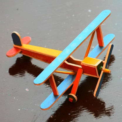 a airplane craft made from craft Popsicle sticks